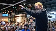 Senate candidate Graham Platner acknowledges the large crowd that attended his town hall in Portland, 25 September, 2025
