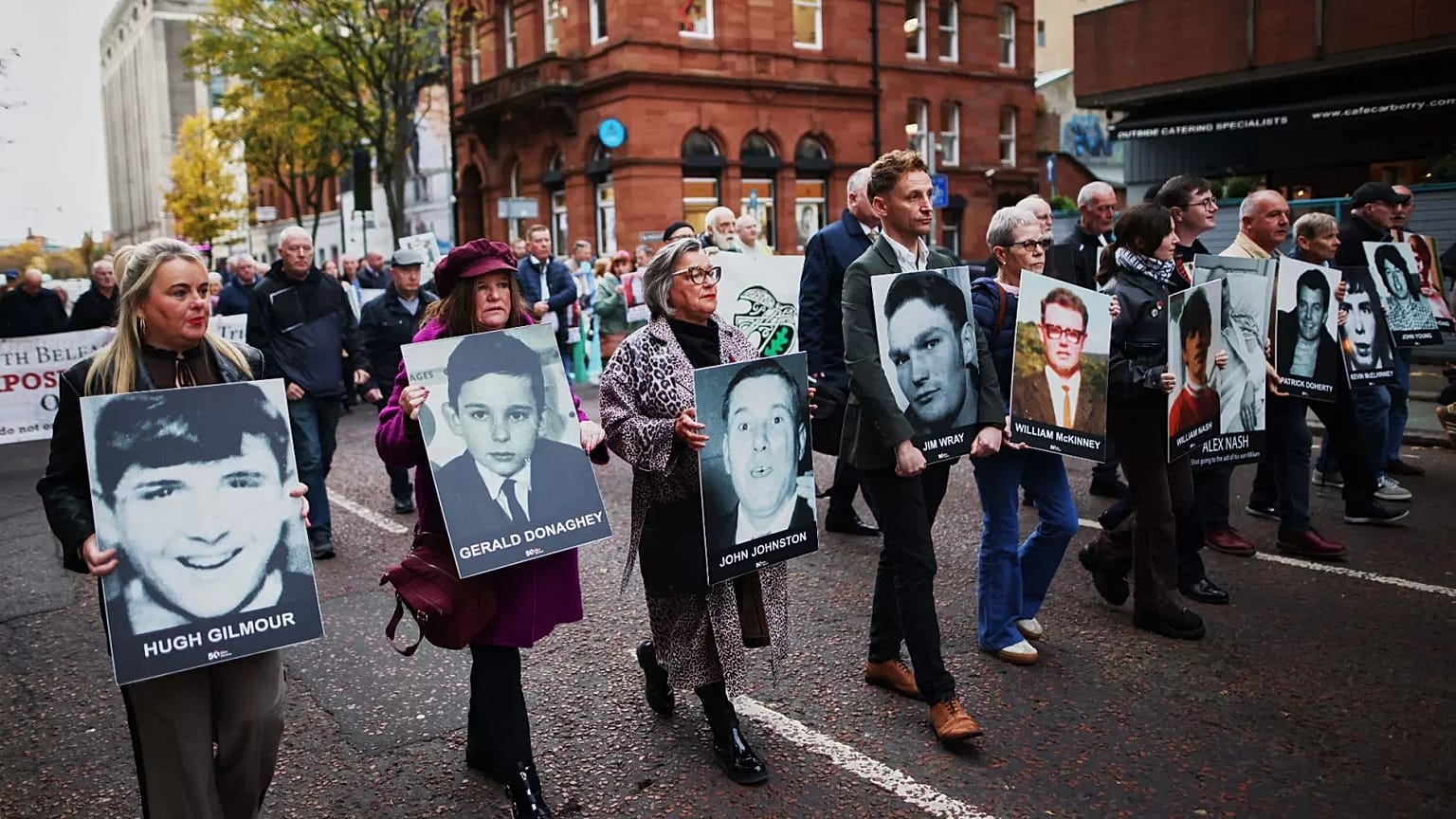 Relatives and supporters of the victims of the 1972 Bloody Sunday massacre march to Belfast Crown Court, 23 October, 2025