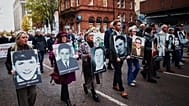 Relatives and supporters of the victims of the 1972 Bloody Sunday massacre march to Belfast Crown Court, 23 October, 2025