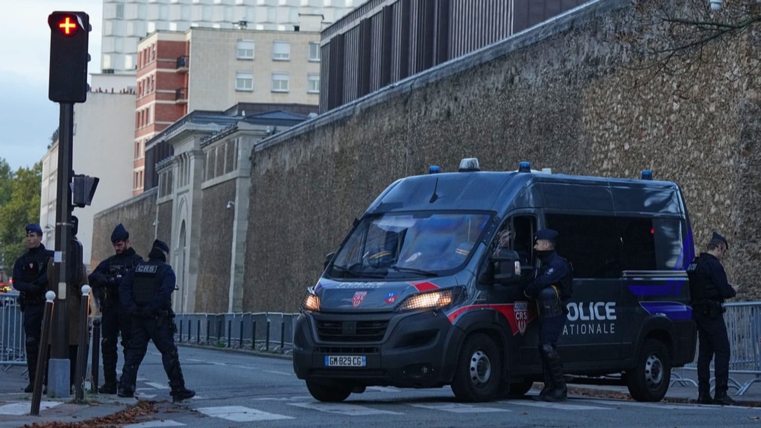 A police van parks outside the Sante prison in Paris, 21 October 2025