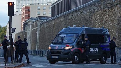 A police van parks outside the Sante prison in Paris, 21 October 2025