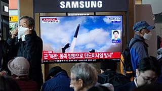 A TV screen shows a file image of North Korea's missile launch during a news programme at Seoul Railway Station, 22 October, 2025