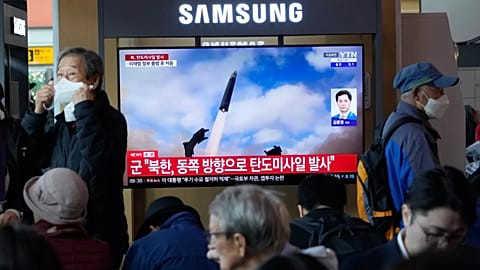A TV screen shows a file image of North Korea's missile launch during a news programme at Seoul Railway Station, 22 October, 2025
