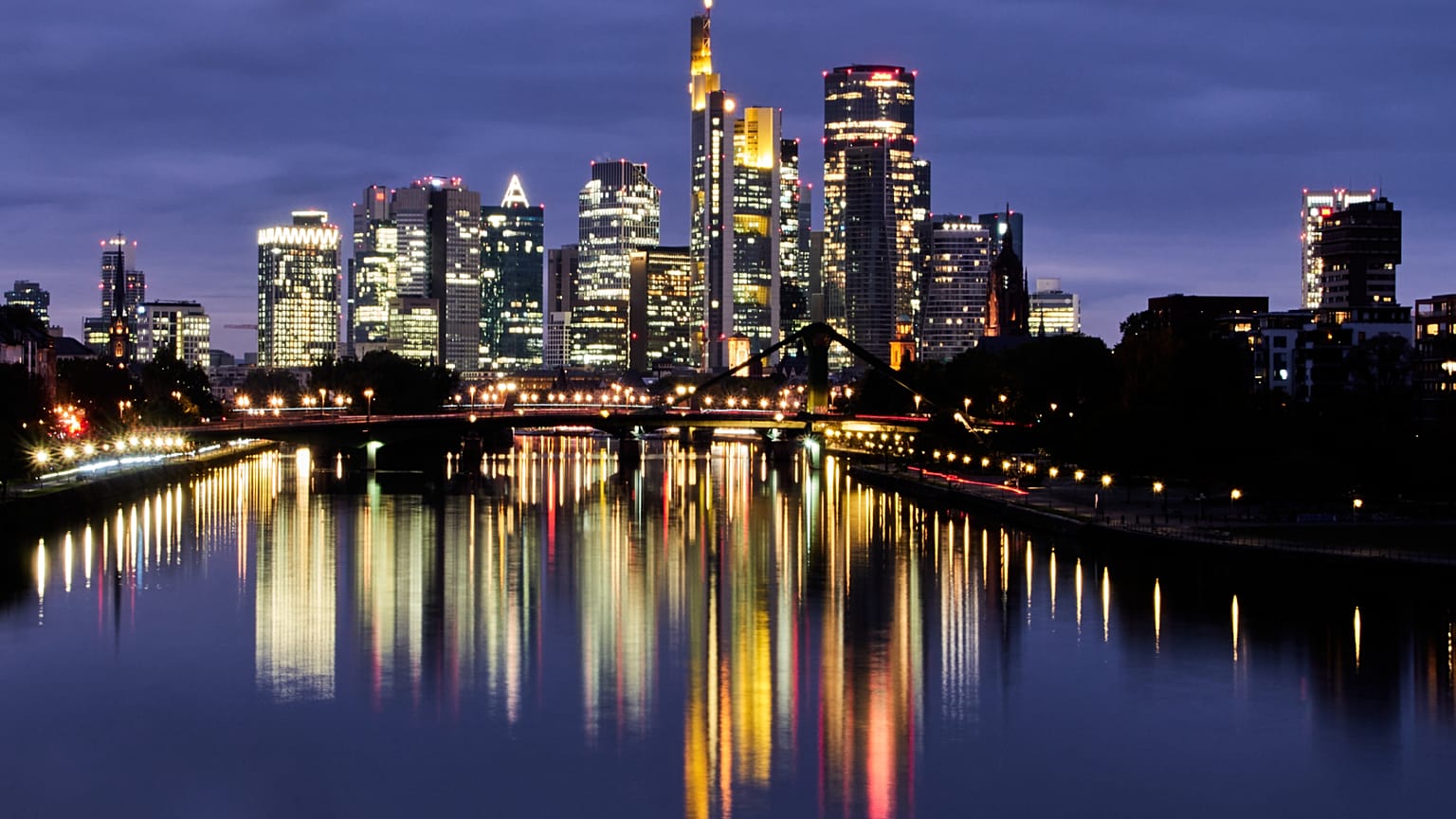 FILE. The buildings of the banking district are reflected in the river Main in Frankfurt, Germany. 16 Oct. 2025.