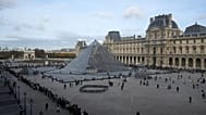 People queue outside the Louvre museum three days after historic jewels were stolen in a daring daylight heist, Wednesday, Oct. 22, 2025 in Paris.