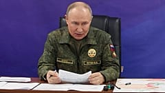 Russian President Vladimir Putin speaks while visiting one of the command posts of the Joint Group of Forces, 26 October 2025