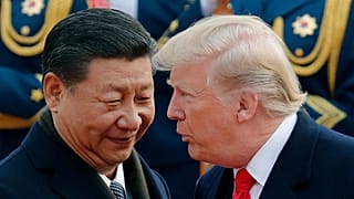 ARCHIVE: US President Donald Trump chats with Chinese President Xi Jinping during a welcome ceremony at the Great Hall of the People in Beijing. Nov. 9, 2017.