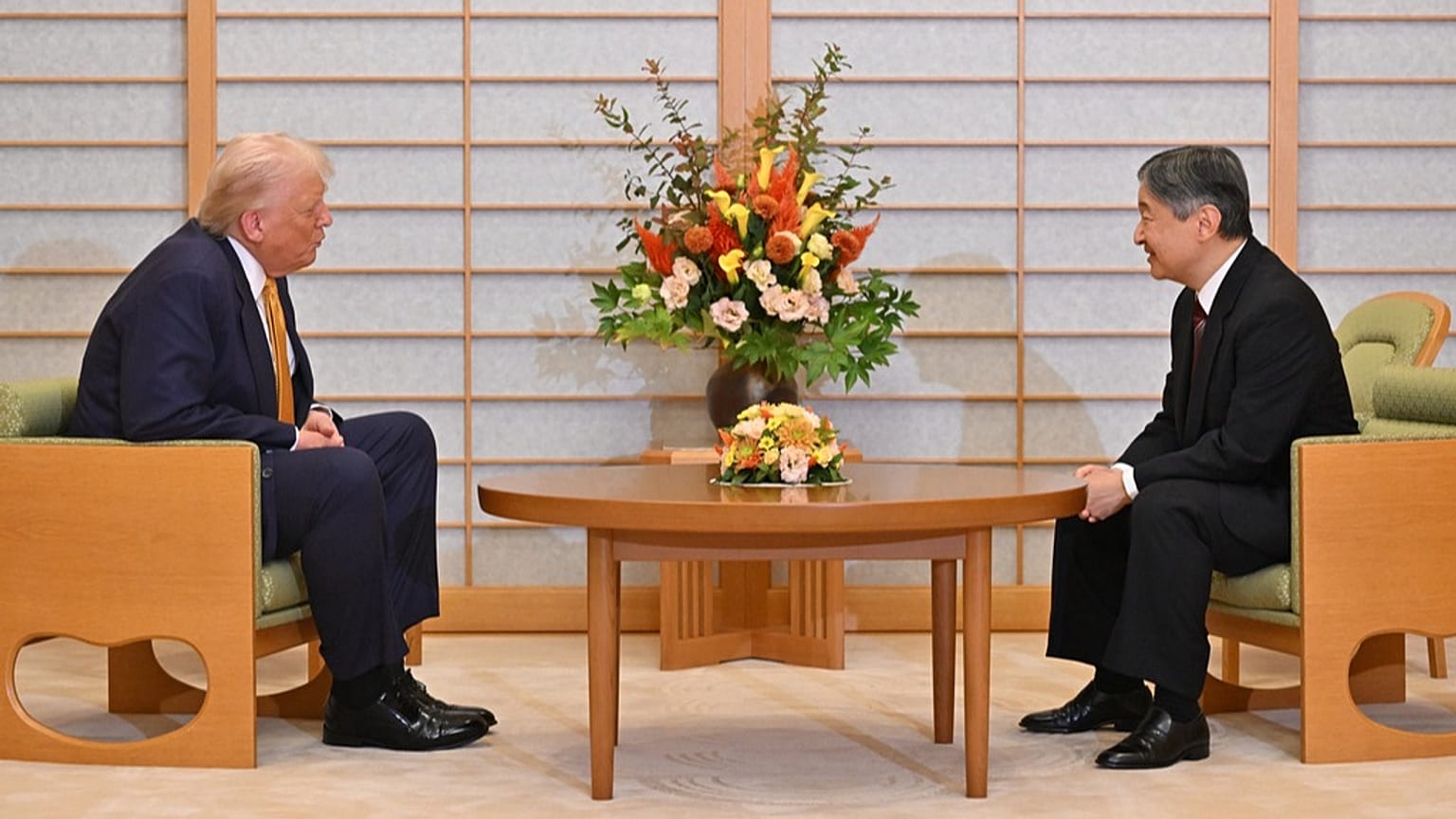 President Donald Trump, left, and Japan's Emperor Naruhito talk during their meeting at the Imperial Palace in Tokyo, Oct. 27, 2025