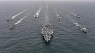 The US Navy's aircraft carrier USS Nimitz, centre, in international waters off South Korea, 4 April, 2023