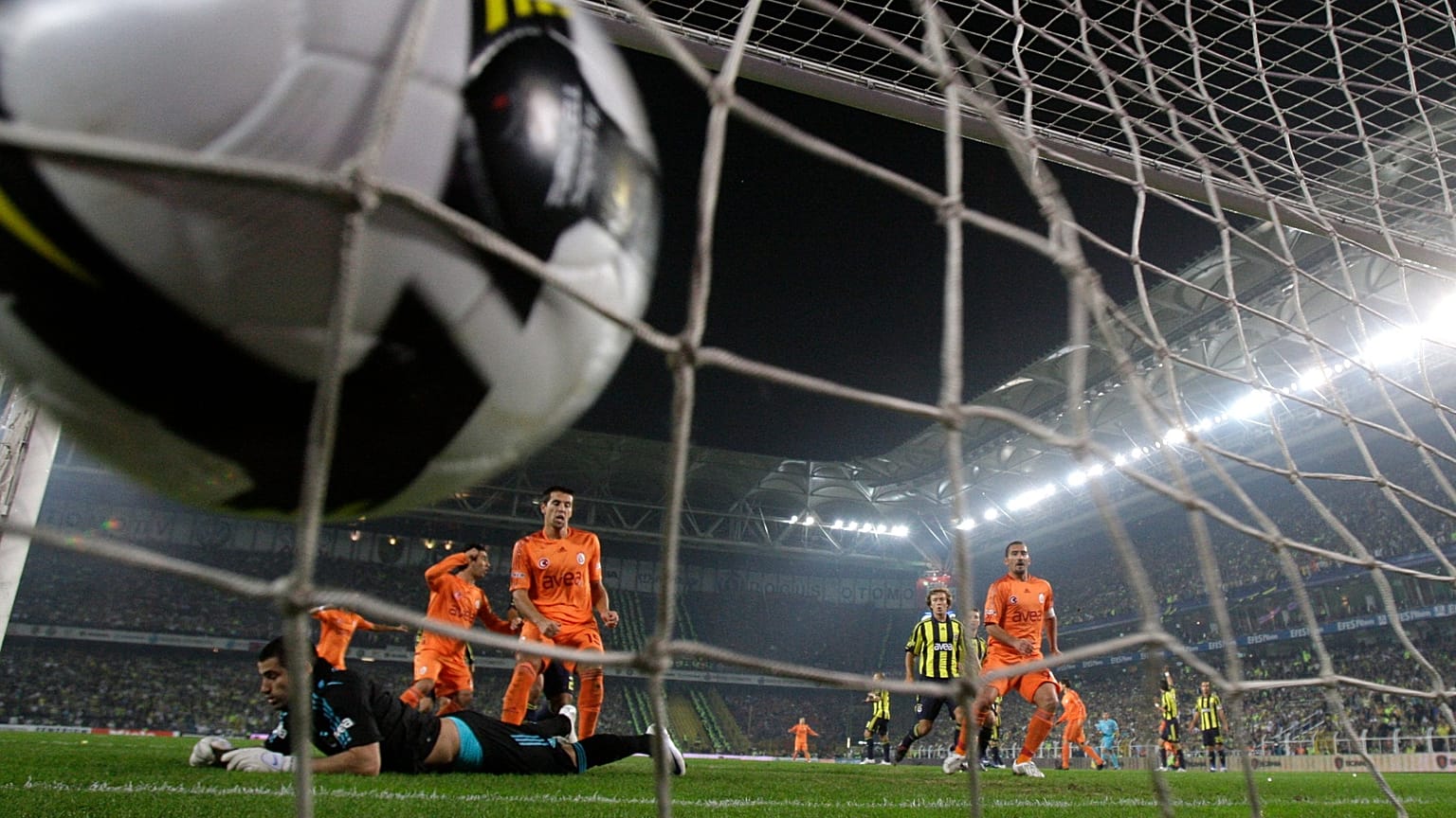 FILE: Fenerbahce's goalkeeper lies on the ground as Galatasaray's forward scores a goal disallowed for offside, at Sukru Saracoglu stadium in Istanbul, 9 November 2008