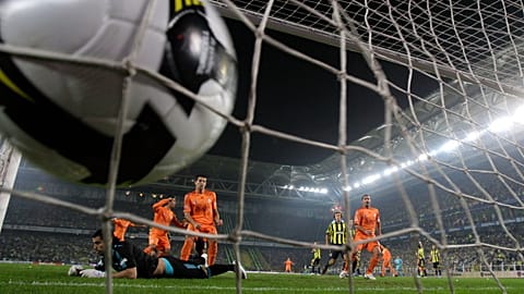 FILE: Fenerbahce's goalkeeper lies on the ground as Galatasaray's forward scores a goal disallowed for offside, at Sukru Saracoglu stadium in Istanbul, 9 November 2008