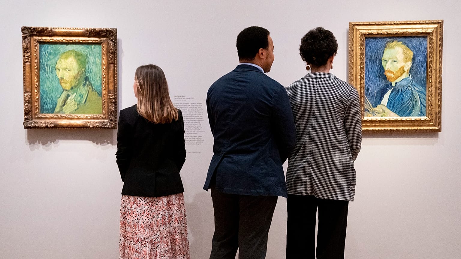 Observers look at pieces by Vincent Van Gogh at The Courtauld Gallery in London on Feb. 1, 2022.