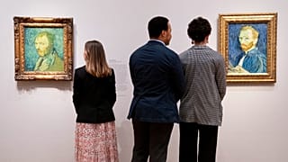 Observers look at pieces by Vincent Van Gogh at The Courtauld Gallery in London on Feb. 1, 2022.