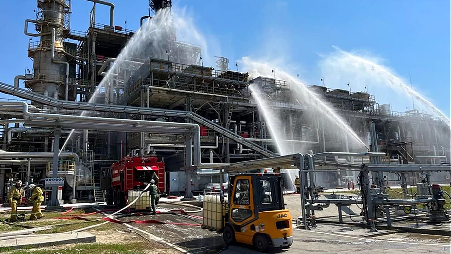 Russian firefighters work at the scene of a fire at the Novoshakhtinsk oil processing plant in the Rostov-on-Don region, 22 June, 2022