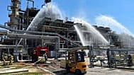 Russian firefighters work at the scene of a fire at the Novoshakhtinsk oil processing plant in the Rostov-on-Don region, 22 June, 2022