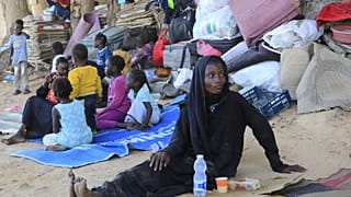 لاجئون سودانيون (أ ف ب/يوسف مراد)