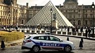 A police car parks in the courtyard of the Louvre museum, one week after the robbery, Sunday, Oct. 26, 2025 in Paris, France.