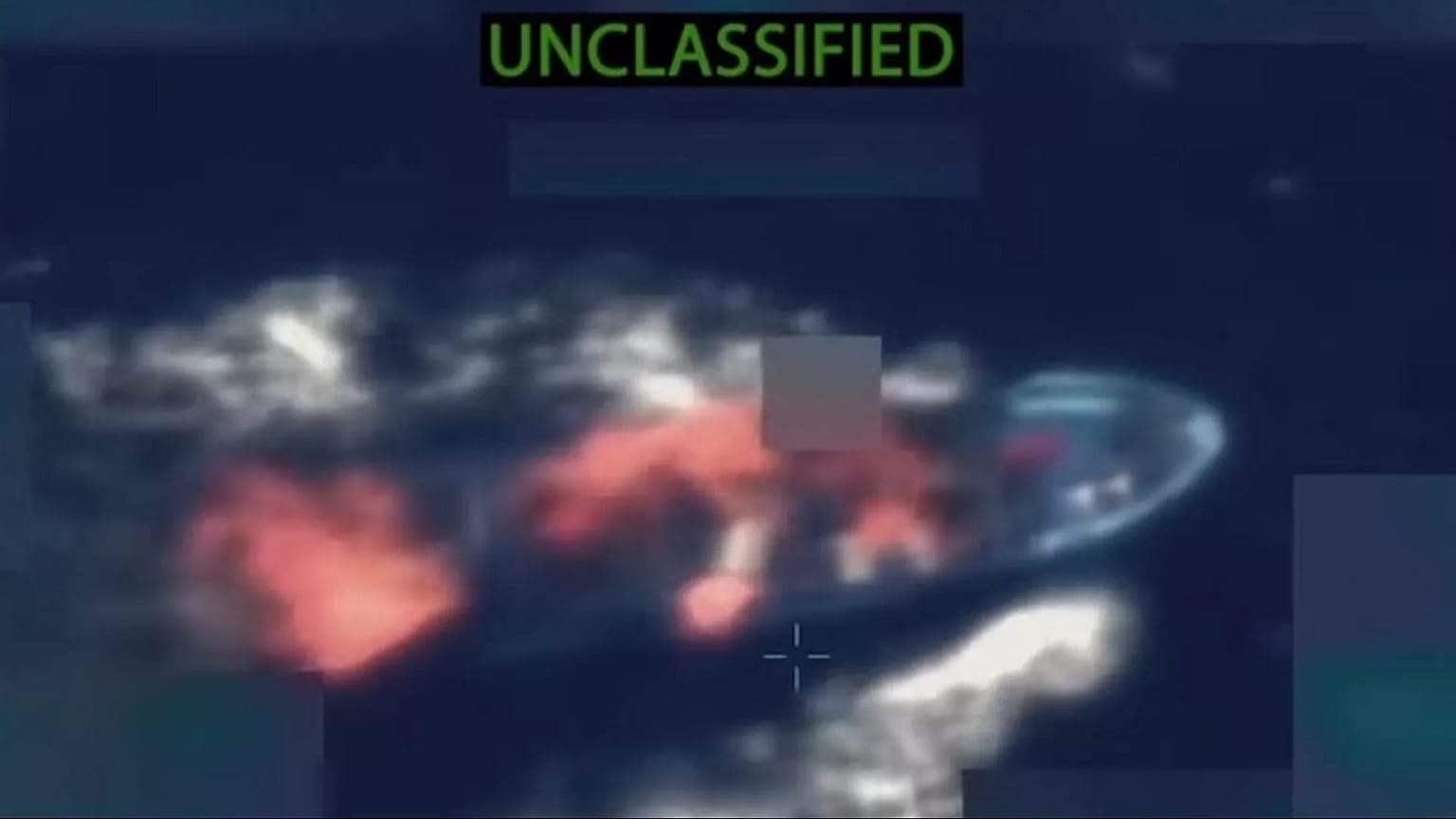 A screenshot from a video showing a US strike on alleged drug smuggling boats in the Pacific
