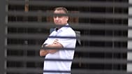 Brazil's former President Jair Bolsonaro stands at the entrance of his home where he is under house arrest in Brasilia, 2 September, 2025