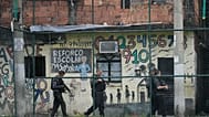 FILE - Police conduct an operation against organized crime in the Mare Complex favela of Rio de Janeiro, Brazil, Monday, Oct. 9, 2023.