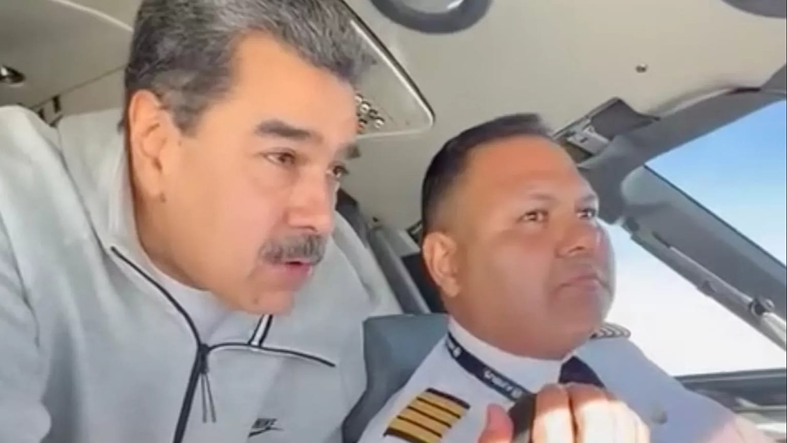 In this image made from a video posted on the Facebook account of Venezuelan President Nicolás Maduro on Dec. 15, 2023, Maduro stands behind pilot Gen. Bitner Villegas in the
