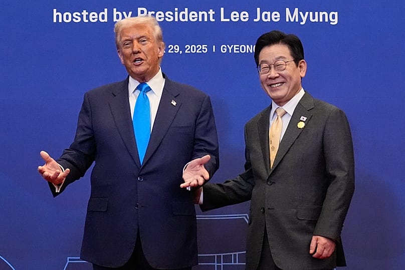 US President Donald Trump poses for a photo with South Korean President Lee Jae Myung during a dinner event in Gyeongju, 29 October, 2025