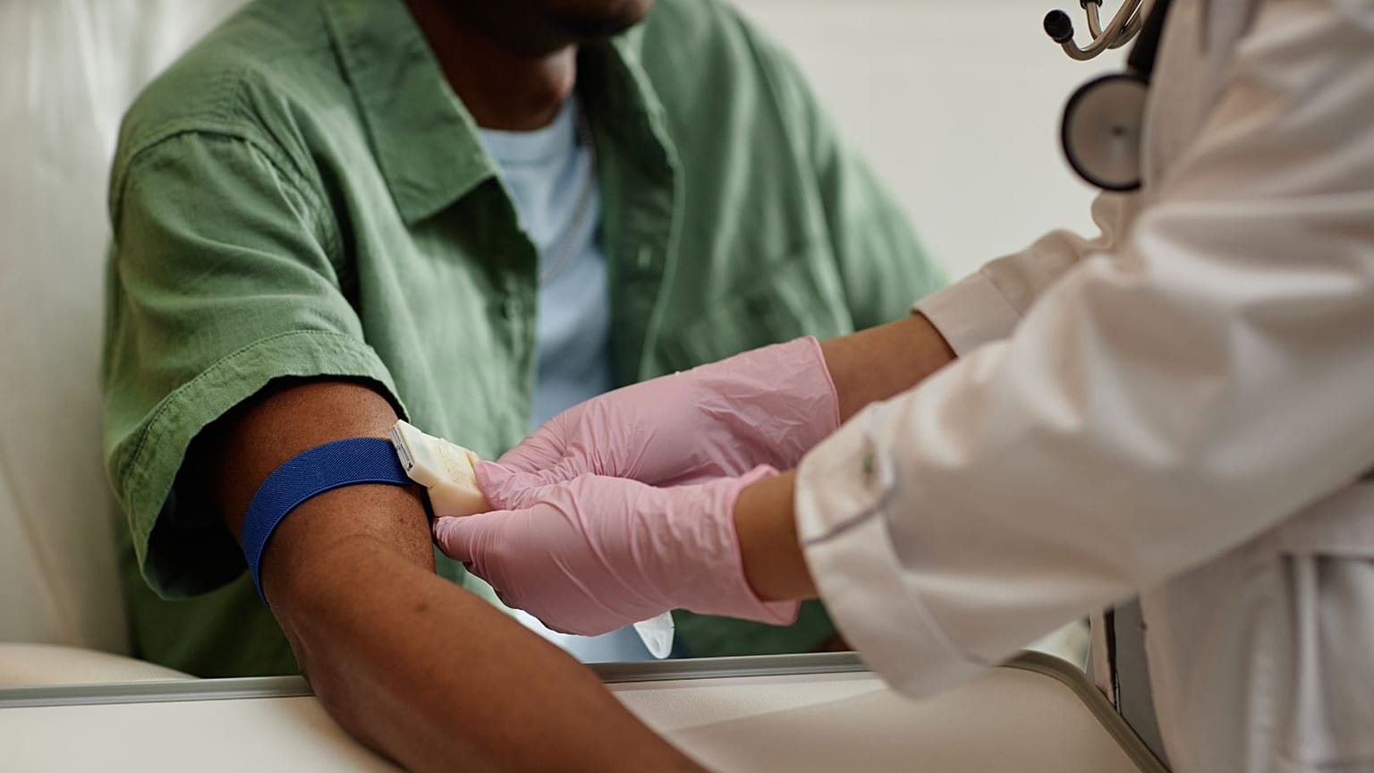 A man prepares to undergo a blood test.