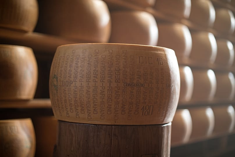 After a brine bath and identity marking, the wheels rest in ageing rooms, often referred to as “cheese cathedrals”.