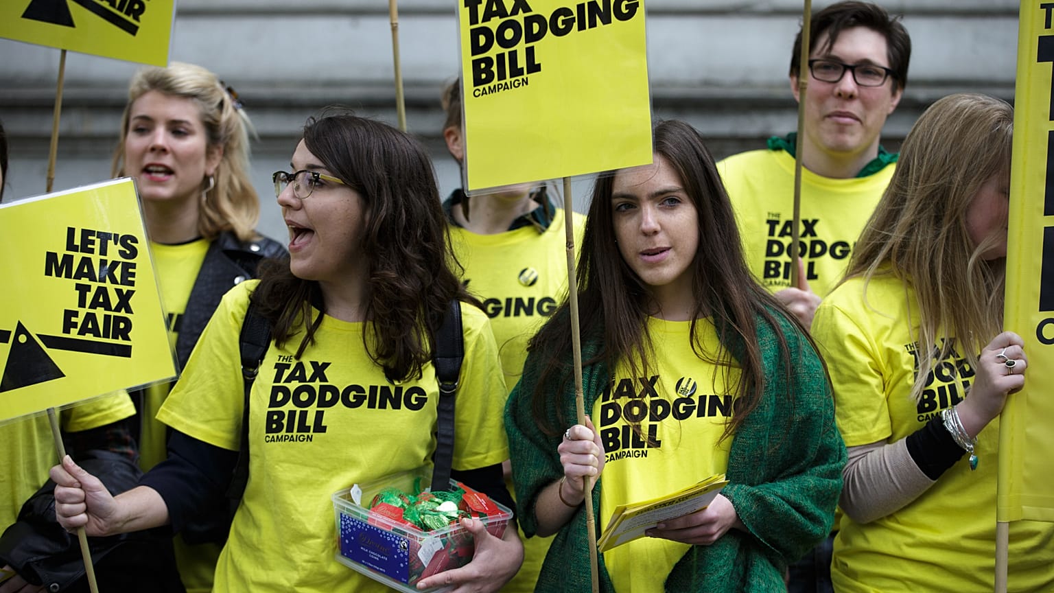 Demonstrators calling for the Government to introduce a tax dodging bill, protest outside Downing Street in London. 9 May 2015.