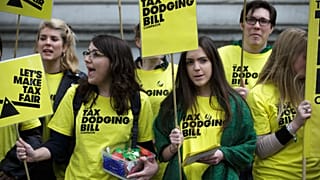 Demonstrators calling for the Government to introduce a tax dodging bill, protest outside Downing Street in London. 9 May 2015.