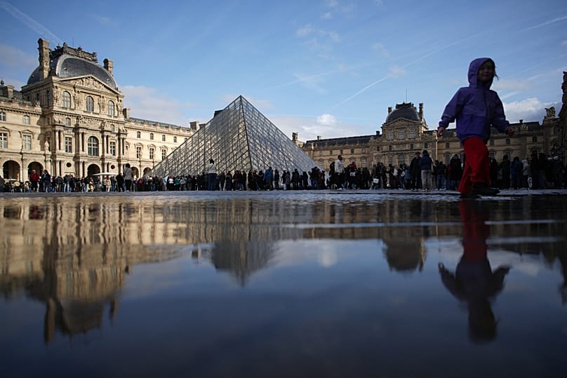 People queue to enter the Louvre museum in Paris, 27 October, 2025