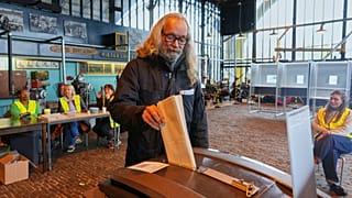 A man casts his ballot at the Kromhout shipyard museum, which is operating as a polling station, during general elections in Amsterdam, 29 October 2025