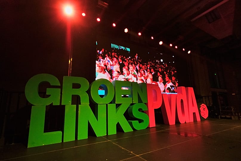 People react during early exit poll results for the PvdA party at an election venue during a general election in Rotterdam