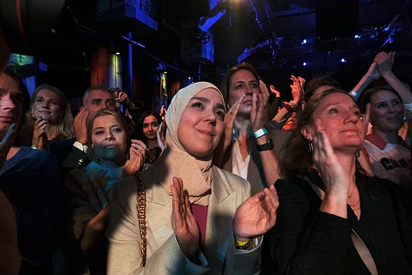 Asmah Lahlah, politician with the Green Left, reacts during early exit poll results for the PvdA party at an election venue during a general election in Rotterdam, Netherlands