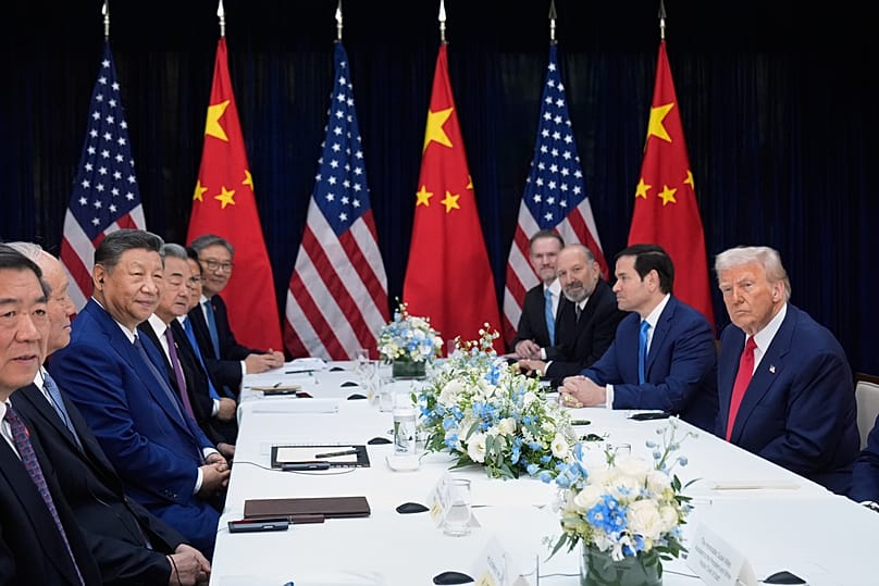 President Donald Trump, right, and Chinese President Xi Jinping, third left, hold their summit talk at Gimhae International Airport in Busan, South Korea, Thursday, Oct. 30.