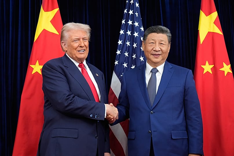 President Donald Trump, left, and Chinese President Xi Jinping shake hands before their meeting at Gimhae International Airport in Busan, South Korea, Thursday, Oct. 30, 2025.