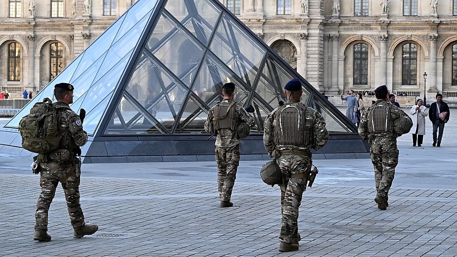 Soldiers patrol in the courtyard of the Louvre museum, 30 October 2025