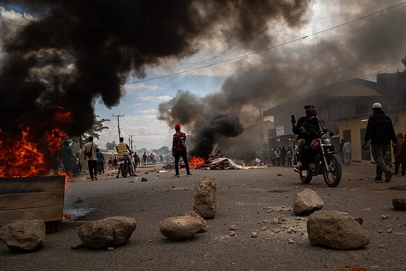 People protest in the streets of Arusha, Tanzania, on election day Wednesday, Oct. 29, 2025