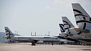 An Aegean Airlines plane approaching the terminal as others planes are parked at Eleftherios Venizelos International Airport in Athens, 31 March, 2020