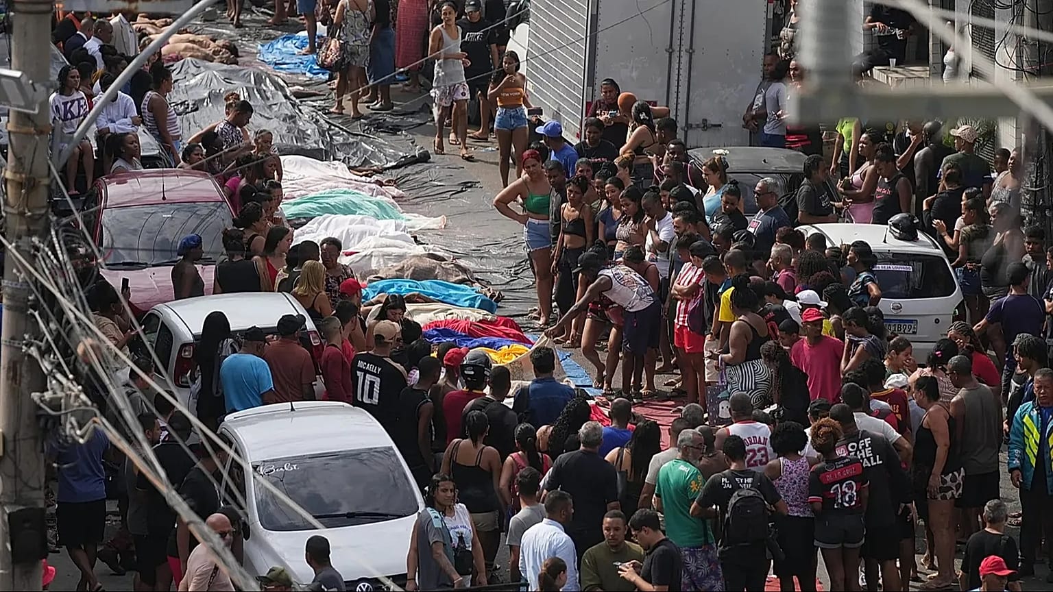 Residents look at the bodies of people killed the day before during a police raid targeting the Comando Vermelho gang in Rio de Janeiro, 29 October, 2025