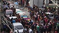 Residents look at the bodies of people killed the day before during a police raid targeting the Comando Vermelho gang in Rio de Janeiro, 29 October, 2025