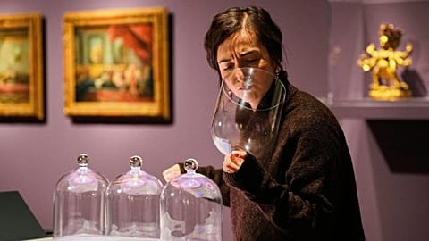 A visitor smells samples at “The Secret Power of Scents,” an exhibition exploring the history of scent at the Kunstpalast Museum in Düsseldorf, Germany.