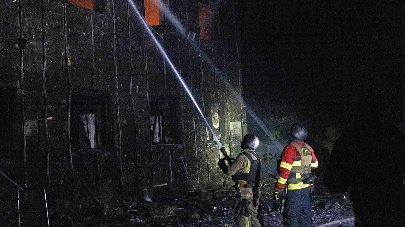 In this photo provided by the Ukrainian Emergency Service, emergency personnel work to extinguish a fire in Sumy, Ukraine, on Friday, Oct. 31, 2025