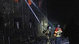In this photo provided by the Ukrainian Emergency Service, emergency personnel work to extinguish a fire in Sumy, Ukraine, on Friday, Oct. 31, 2025