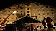 Firefighters and emergency teams work after a fire that broke out at a hotel in the ski resort of Kartalkaya, 21 January, 2025