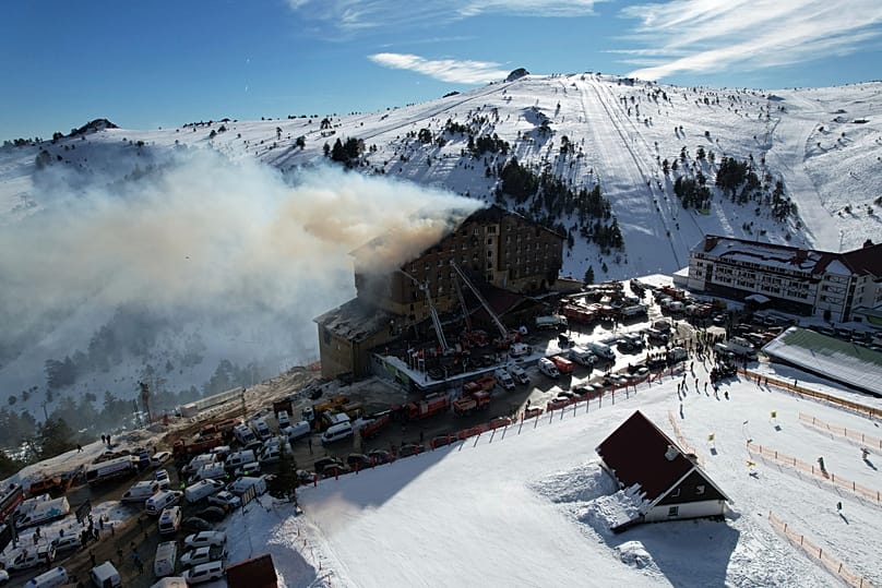 Firefighters work to extinguish a fire in a hotel at a ski resort of Kartalkaya, 21 January, 2025