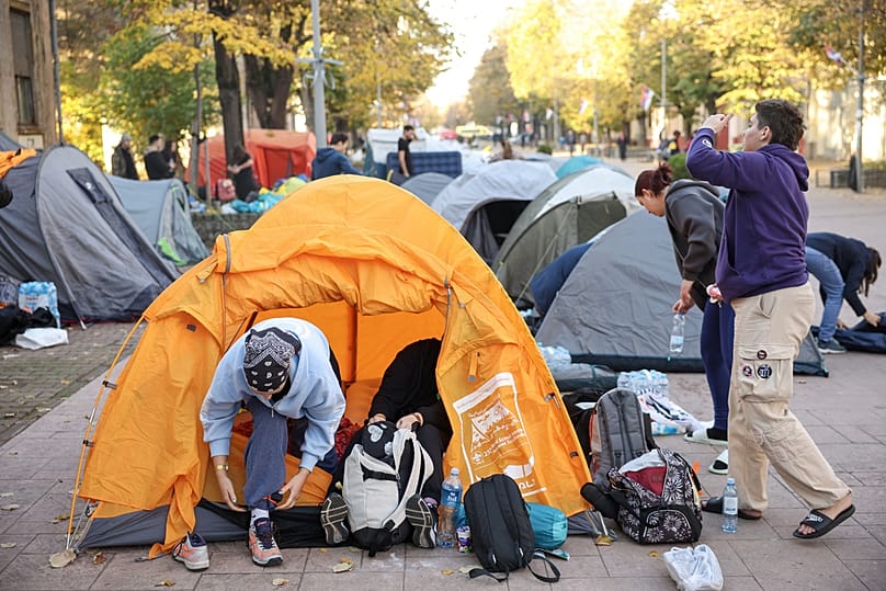Protesters prepare to continue marching to Novi Sad for a huge rally marking the first anniversary of a train station disaster, Indjija, Serbia, Friday, Oct. 31, 2025