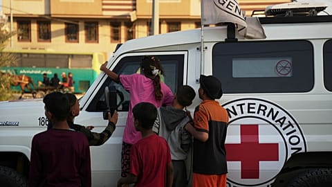 Red Cross vehicles carrying the bodies of two people believed to be deceased hostages handed over by Hamas, Deir al-Balah, Gaza, Thursday, Oct. 30, 2025