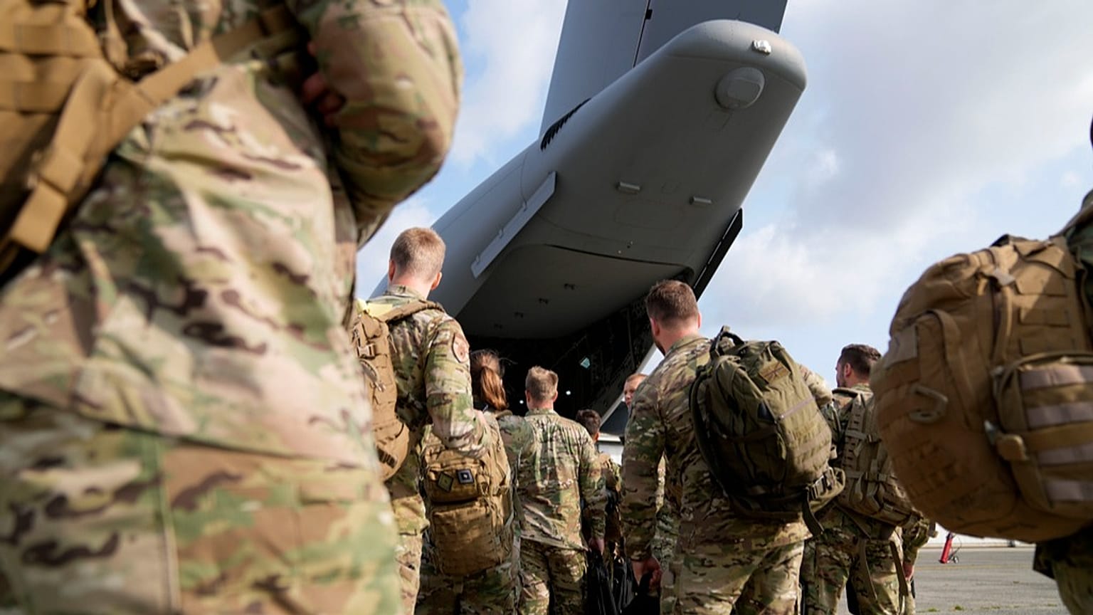 Soldiers from Belgium and Luxembourg prepare to board a military transport plane at Melsbroek Military Airport in Melsbroek, Belgium, Tuesday, July 4, 2023.