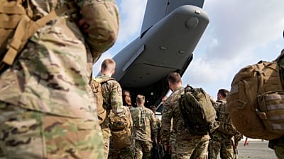 Soldiers from Belgium and Luxembourg prepare to board a military transport plane at Melsbroek Military Airport in Melsbroek, Belgium, Tuesday, July 4, 2023.